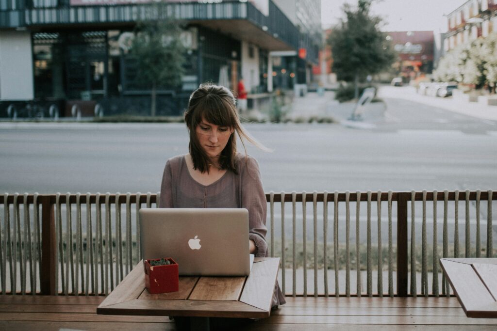 Woman working on her laptop in a terrace